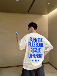 BURN THE RULE BOOK TEE